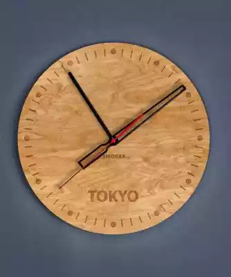 Dekoracyjny,  drewniany zegar na ścianę - grawer Tokyo - Dąb Dąb Dekoracyjny,  drewniany zegar na ścianę - grawer Tokyo Naturalny,  ciepły z motywem prawdziwego drewna zegar na ścianę. Metalowe wskazówki dopełniają dzieła ciepłego,  a zarazem nowoczesnego wzornictwa. wymiary tarczy: 35cm m