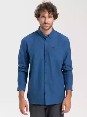 przewiewny materiał: 100% bawełna
krój slim fit
kołnierz z guzikami (button-down)
otwarta listwa na guziki 
kieszeń na lewej piersi z detalem Volcano z eco skóry
mankiety na dwa guziki
kolor: niebieski
Niebieska koszula męska – klasyczny casual
Męska koszula K-SID jest w fasonie slim 