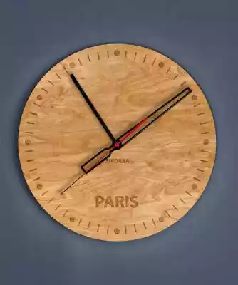 Dekoracyjny,  drewniany zegar na ścianę - grawer Paris - Dąb Dąb Dekoracyjny,  drewniany zegar na ścianę - grawer Paris Naturalny,  ciepły z motywem prawdziwego drewna zegar na ścianę. Metalowe wskazówki dopełniają dzieła ciepłego,  a zarazem nowoczesnego wzornictwa. wymiary tarczy: 35cm m